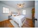 Bright bedroom featuring hardwood floors, large windows, ceiling fan, and neutral decor at 106 Rachel St, Goose Creek, SC 29445