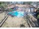 Backyard pool with patio area and nearby brick home provides a cozy space for outdoor enjoyment and relaxation at 106 Rachel St, Goose Creek, SC 29445