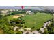 Aerial view of a baseball field, sports field, pond, and community at 108 Fairbanks Oak Aly # 201, Charleston, SC 29492