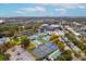 Overhead view of a tennis and pickleball complex near a stadium and neighborhood, surrounded by lush greenery at 108 Fairbanks Oak Aly # 201, Charleston, SC 29492