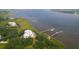 Panoramic aerial view of waterfront condos with private docks and lush surroundings at 108 Fairbanks Oak Aly # 201, Charleston, SC 29492