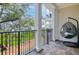 Balcony with a hanging chair overlooking beautiful scenic views at 108 Fairbanks Oak Aly # 201, Charleston, SC 29492