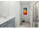 Modern bathroom featuring a double sink vanity, large mirror, and glass-enclosed shower at 1105 Mossy Rock Dr, Summerville, SC 29485