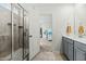 Clean bathroom showcasing walk-in shower and doorway to carpeted bedroom at 1105 Mossy Rock Dr, Summerville, SC 29485