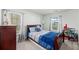 Cozy bedroom with a sleigh bed, bright windows, and charming decor at 1105 Mossy Rock Dr, Summerville, SC 29485