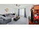 Bright bedroom with a comfortable gray sectional couch, ottoman, and cozy decor at 1105 Mossy Rock Dr, Summerville, SC 29485