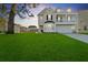 Charming two-story home with landscaped yard, a two-car garage and a lovely second story porch at 1105 Mossy Rock Dr, Summerville, SC 29485