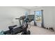 Home gym featuring a treadmill, stationary bike, weights and a view of the outdoors at 1105 Mossy Rock Dr, Summerville, SC 29485