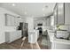 Modern kitchen featuring gray cabinets, quartz countertops, stainless steel appliances, and a center island at 1105 Mossy Rock Dr, Summerville, SC 29485