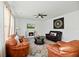 Cozy living room with a ceiling fan, fireplace, plush seating, and large windows at 1105 Mossy Rock Dr, Summerville, SC 29485