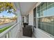 Charming front porch with wicker seating and view of the neighborhood at 1105 Mossy Rock Dr, Summerville, SC 29485