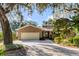 Charming brick home featuring a well-maintained lawn and a two-car garage at 119 Riverland Dr, Charleston, SC 29412