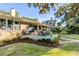 Relaxing backyard patio with comfortable seating and serene views of the lush garden at 119 Riverland Dr, Charleston, SC 29412