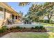 Charming outdoor patio area perfect for entertaining and relaxing amidst lush landscaping at 119 Riverland Dr, Charleston, SC 29412