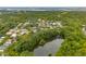 An aerial view of a lush neighborhood and pond near a community of colorful homes at 121 Jakes Ln, Mount Pleasant, SC 29464