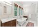 Elegant bathroom featuring a clawfoot tub, double vanities, and serene natural light at 121 Jakes Ln, Mount Pleasant, SC 29464