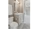 Clean bathroom featuring a single sink vanity, a toilet, and a view into another room at 121 Jakes Ln, Mount Pleasant, SC 29464