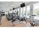 Bright fitness center with modern equipment and large windows overlooking outdoor pool at 121 Jakes Ln, Mount Pleasant, SC 29464
