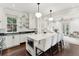 Bright kitchen with white cabinets, marble countertops, an island with seating, and stainless steel appliances at 121 Jakes Ln, Mount Pleasant, SC 29464