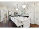Bright kitchen with white cabinets, marble countertops, an island with seating, and stainless steel appliances at 121 Jakes Ln, Mount Pleasant, SC 29464