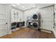 Modern laundry room with dual washer/dryer and desk area with natural light at 121 Jakes Ln, Mount Pleasant, SC 29464