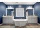 Elegant bathroom with a standalone tub, dual vanities, and stylish fixtures, creating a serene atmosphere at 121 Warbler Way, Summerville, SC 29483