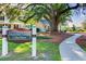 The Shady Oak Cottage Coffee House in a lush setting with a sidewalk and mature trees at 121 Warbler Way, Summerville, SC 29483