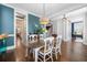 Open-concept dining room with hardwood floors and a view of the staircase at 121 Warbler Way, Summerville, SC 29483