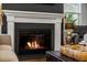 Inviting fireplace with white mantel and dark surround, creating a cozy focal point in the living space at 121 Warbler Way, Summerville, SC 29483