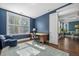 Well-lit home office with hardwood floors and view of the dining area at 121 Warbler Way, Summerville, SC 29483