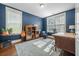 Bright home office with hardwood floors, blue walls, and an area rug at 121 Warbler Way, Summerville, SC 29483