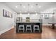 Open-concept kitchen with an island, stainless steel appliances, and ample countertop space, perfect for culinary enthusiasts at 121 Warbler Way, Summerville, SC 29483