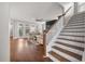 Living room featuring stairs, a ceiling fan, and a view of the backyard at 121 Warbler Way, Summerville, SC 29483