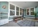 Screened-in porch with a picnic table and decor at 121 Warbler Way, Summerville, SC 29483