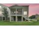 Elevated home showcasing a screened in back porch and large backyard at 1308 Lieben Rd, Mount Pleasant, SC 29466