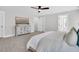 Bright bedroom featuring a ceiling fan, dresser, and light-colored carpet at 1308 Lieben Rd, Mount Pleasant, SC 29466