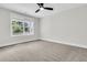 Bedroom with ceiling fan and large window providing plenty of natural light at 1308 Lieben Rd, Mount Pleasant, SC 29466