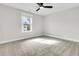 Bedroom featuring a ceiling fan and a window overlooking a treed lot at 1308 Lieben Rd, Mount Pleasant, SC 29466