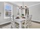 Dining Room area filled with natural light, white table, and modern chandelier at 1308 Lieben Rd, Mount Pleasant, SC 29466