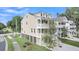 Attractive raised beach house featuring dual porches, a driveway, and lush landscaping at 1308 Lieben Rd, Mount Pleasant, SC 29466