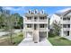 Charming elevated home featuring double porches, dormer windows, and manicured lawn at 1308 Lieben Rd, Mount Pleasant, SC 29466