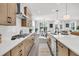 Modern kitchen with a large island, stainless steel appliances, and access to the dining and living areas at 1308 Lieben Rd, Mount Pleasant, SC 29466