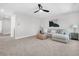 Inviting living room with a gray sectional sofa, woven ottoman, ceiling fan, and neutral decor at 1308 Lieben Rd, Mount Pleasant, SC 29466