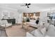 Open living room with neutral decor and a view into the modern kitchen and dining areas at 1308 Lieben Rd, Mount Pleasant, SC 29466