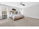 Serene main bedroom with a ceiling fan, cozy bed, neutral walls, and ample natural light from the windows at 1308 Lieben Rd, Mount Pleasant, SC 29466