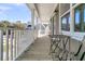 Covered porch with outdoor seating and views of the neighborhood and blue skies at 1308 Lieben Rd, Mount Pleasant, SC 29466