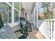 Relaxing covered porch featuring rocking chairs and comfortable seating with nature views at 1308 Lieben Rd, Mount Pleasant, SC 29466