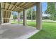 View of the area under the porch featuring concrete pillars and well-manicured lawn at 1308 Lieben Rd, Mount Pleasant, SC 29466