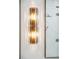 Elegant bathroom sconce with ornate details, providing warm lighting and enhancing the luxurious ambiance at 15 Watroo Pt, Daniel Island, SC 29492