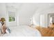 Bright bedroom with white walls, hardwood floors, and a cozy window at 15 Watroo Pt, Daniel Island, SC 29492